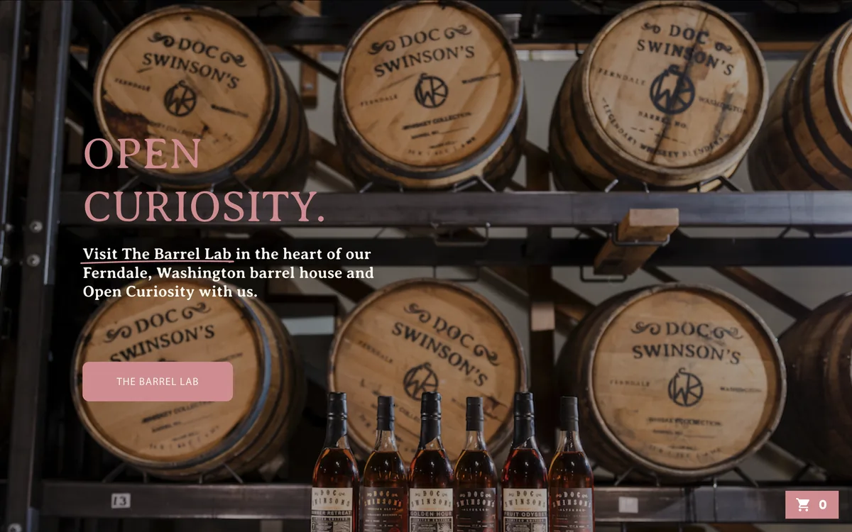 Doc Swinson’s whiskey homepage with the headline Open Curiosity. over branded barrels and a row of whiskey bottles