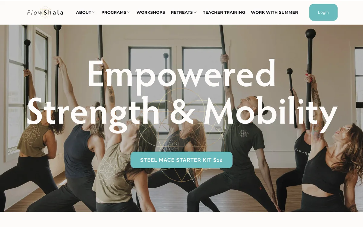 Flowshala homepage with the headline Empowered Strength & Mobility over a steel mace class stretching in a bright studio