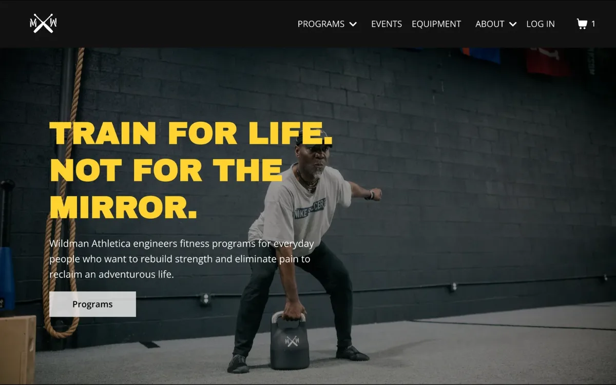 Wildman Athletica homepage with the headline Train for life. Not for the mirror. over an athlete lifting a kettlebell